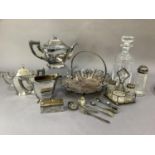 A three piece silver plated tea service of rectangular panelled outline, oval cake basket with swing