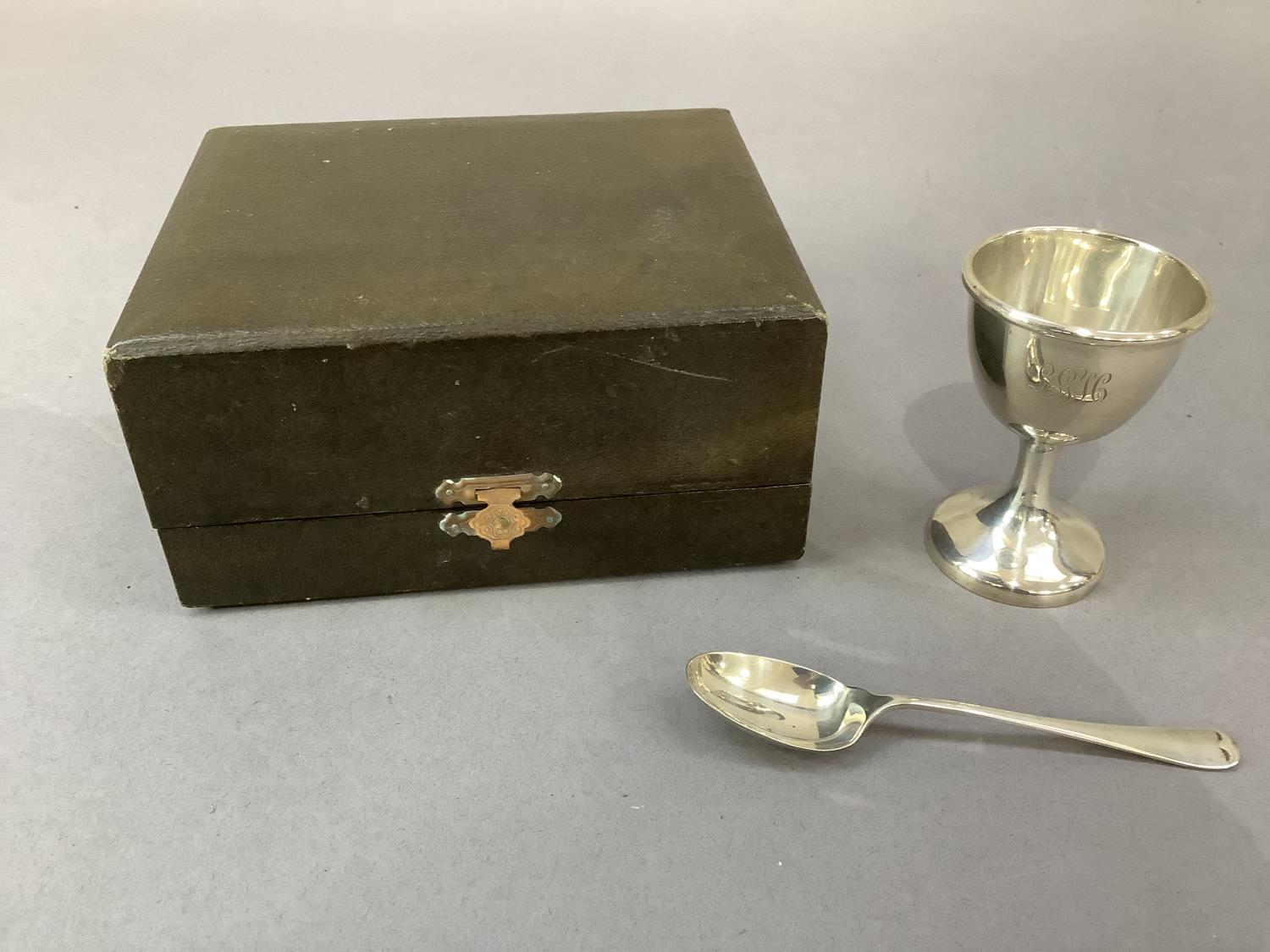 A silver egg cup initialled LGH and spoon, Birmingham 1956