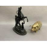 A cast brass pig piggy bank together with a black painted cast metal model of a 'Marley' horse and