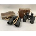 Two pairs of Ross binoculars, both in brown leather cases