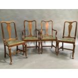 A set of four Queen Anne style mahogany dining chairs with hoop backs and vase splats, cabriole legs