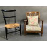 An ebonized chair with rush seat together with a beech nursing chair with fret cut pierced back,