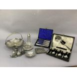 A silver plated pierced basket with swing handle, a tea pot stand, plated spoons, cased (2 sets),