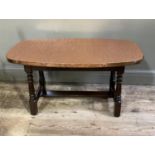 A copper topped occasional table, hammer textured with studded edge, on oak stained beech frame,