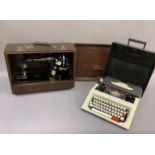 An Olivetti typewriter, cased, together with a vintage Singer sewing machine, FB394246, black
