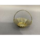 An Elizabeth II silver gilt circular sweetmeat / basket, pierced overall with bands of graduated