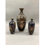 A pair of Japanese cloisonné baluster lamps decorated with stylised dragons and mythical beasts on