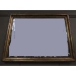 A gilt framed wall mirror, rectangular, 77cm by 104cm