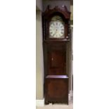A George IV mahogany and oak long case clock, the arched dial painted with beached fishing boats
