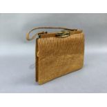 A tan snakeskin handbag