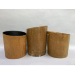 Three vintage cylindrical wooden waste paper bins, each approx 31cm high, one at fault