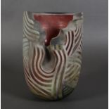 Paul Muchan (b.1948), an earthenware vase, cut away section to the body, matt grey linear designs on