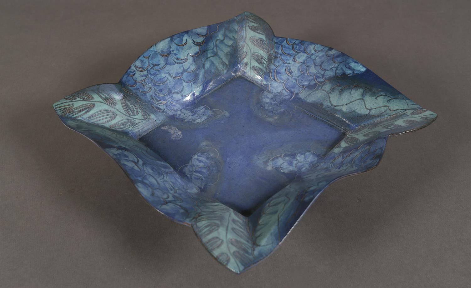 Jackie Walton (b.1941), an earthenware dish of square outline with blue-grey and green glaze,
