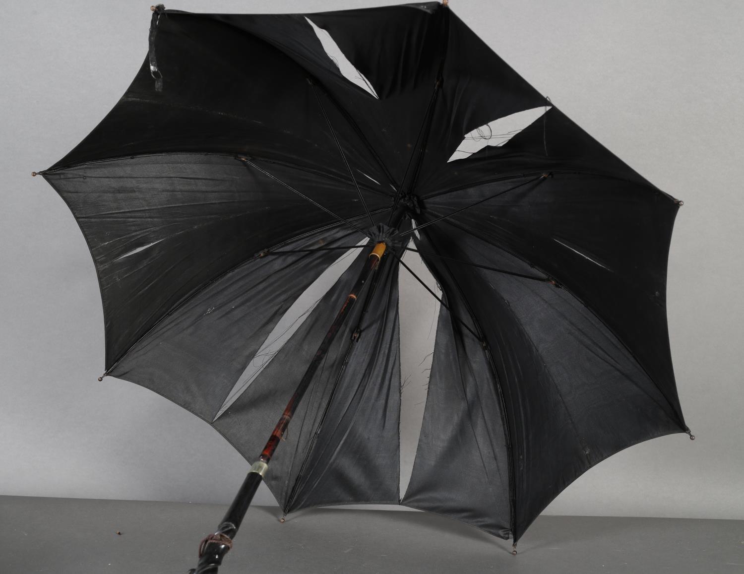 A Paragon & Sons black silk parasol with tapered pierced ebony handle ribbon carved, white metal - Image 6 of 6