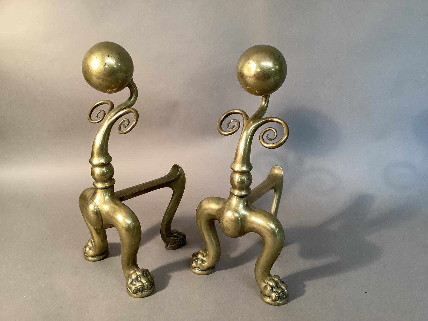 A pair of Victorian brass andirons with sphere and scroll uprights on pair of bold cabriole legs - Image 2 of 2