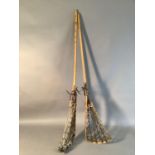 Two vintage Lacrosse sticks with leather and cat gut heads, 112cm long approx