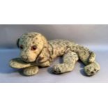 A pre-war soft toy leopard, reclining, hard plastic eyes and stitched features, play worn, 74cm long