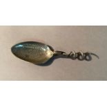 A rare vintage Hazeline Cream combination folding medicine spoon, hinged corkscrew stem and