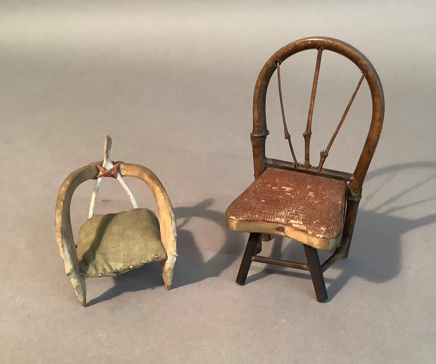 A doll's house chair made from two wishbones together with another with bamboo frame, 7cm and 12cm