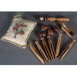A treen thread winder and needlecase, a needle box, embroidered pin cushion, set of four walnut