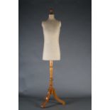 A late 19th century tailor's dummy on a turned beech column with brass locking collar, three