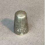 Of sewing interest - a Dutch silver fable thimble embossed with monkeys sitting beside a