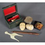 A 1920s work box; an ivory thread winder, two darning eggs and a white metal pin cushion