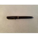 A Parker Victory in black, c. 1950s, 14k Pen N nib, button fill, 13cm long