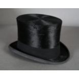 A Lock & Co, Hatters, St James Street, London, black top hat, the interior initialled G.N.V. on