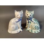 Two Rye pottery cats, one with pale green markings and blue bow, the other with blue and red flowers
