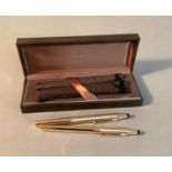 Two Cross gold plated fountain pens with Cross 14k nibs, 13.25cm long, both with felt sleeves and