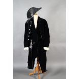 A court suit of dark blue velvet comprising coat with cream lace cuffs, breeches, waistcoat and