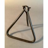 An American wrought iron 'Call to Dinner' with triangular frame and pierced clapper that forms a