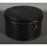 An early 20th black tin wig box, circular, 16cm x 29cm diameter