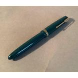 A Parker fountain pen in green, 14k nib, stamped Made in England 25.9, 12.5cm long