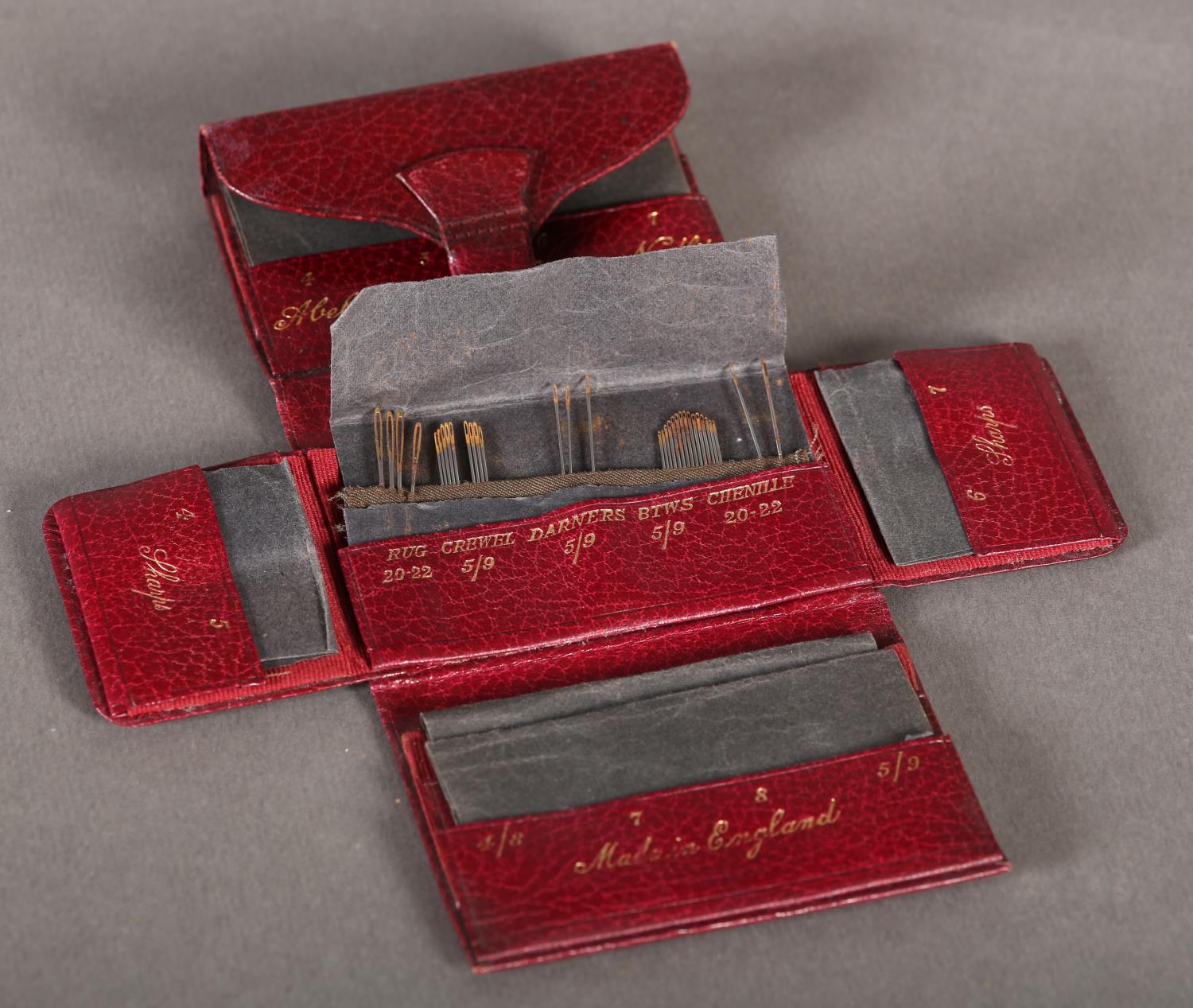 An Edwardian maroon leather needle wallet stamped in gilt Abel Morrall's Sewing Needles, - Image 2 of 3