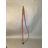 A bamboo walking stick of tapered form with antler pommel and foliate embossed silver plated collar,