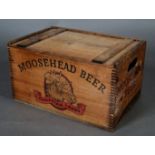 A Moosehead Beer wooden crate with slide off lid and finger grips, 46cm wide x 30.5cm deep x 25cm