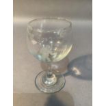 A wine glass etched with The First Men on The Moon 20th July 1969 Armstrong and Aldrin with a