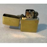 A Zippo brass cased lighter, stamped to the base Zippo 1932-1986, Bradford PA