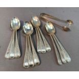 A set of twelve silver teaspoons and a pair of sugar tongs, bright cut decoration and initialled 'S'