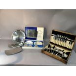 A canteen of silver plated cutlery together with a boxed set silver plated table mats and