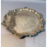 A silver salver with pie crust and beaded rim with shell and foliate motifs, engraved presentation