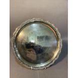 A silver salver with gadroon wavy rim, circular, presentation inscription, 25cm, London 1900,