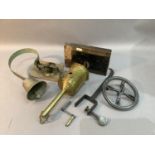 A Victorian brass meat jack and key together with a steel range arm and wheel and an early 20th