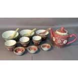 A Chinese teapot and six tea bowls, rice bowls and ladles etc