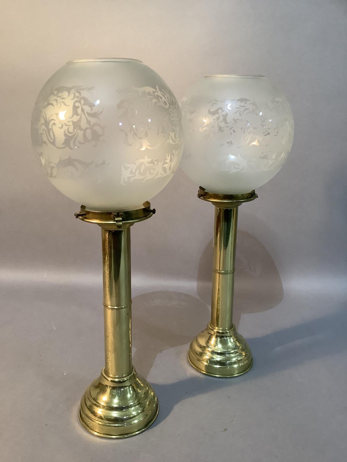 A pair of gilt metal candle holders with opaque glass globes - Image 2 of 2