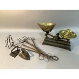 Four Victorian and Later wire toasting forks together with two flat irons for delicate work together
