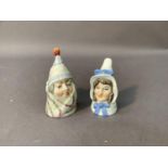 A pair of Royal Worcester candle snuffers modelled as Mr and Mrs Caudle, 8cm high and smaller,