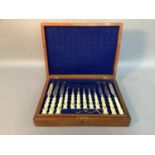 A Victorian mahogany canteen of twelve ivory handle EPNS dessert knives and forks, each incised
